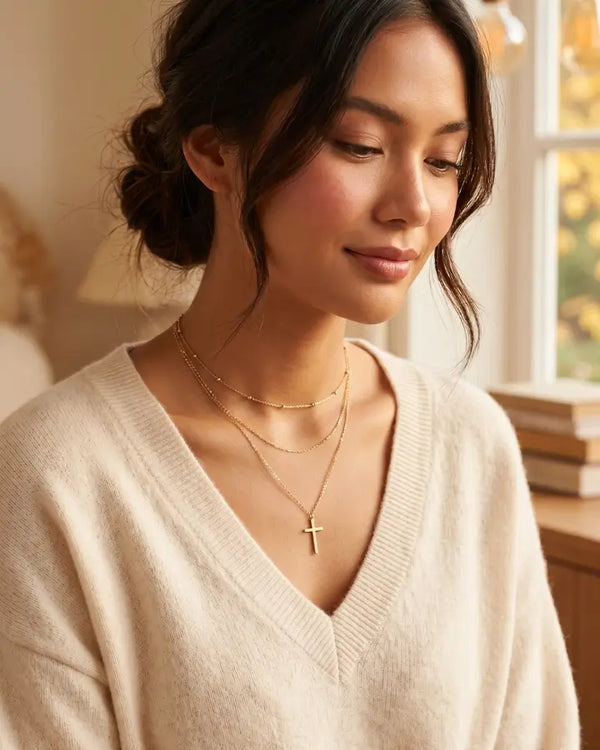 Grace H. wearing the Elara Cross Layered Necklace