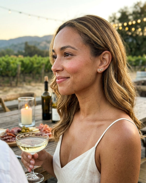 BIANCA L. wearing the Cora Infinity Stud Earrings