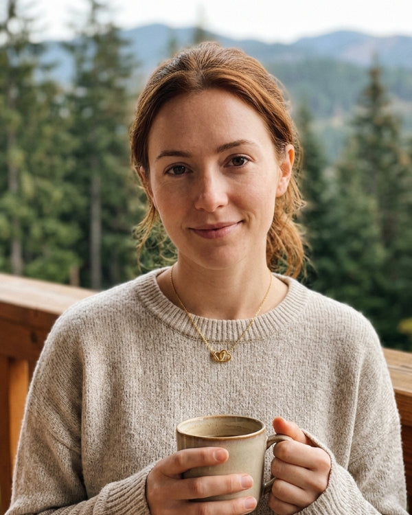 EMMA L. wearing the Amara Double Heart Necklace