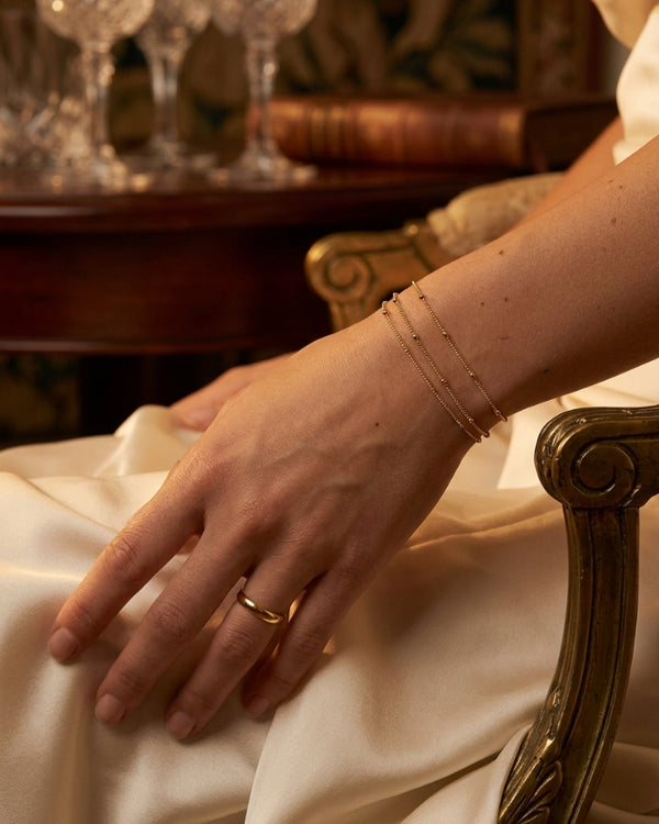 DIYA K. wearing the Sena Dainty Charm Bracelet