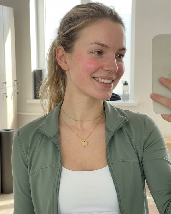 DELILAH K. wearing the Thea Coin Layered Necklace