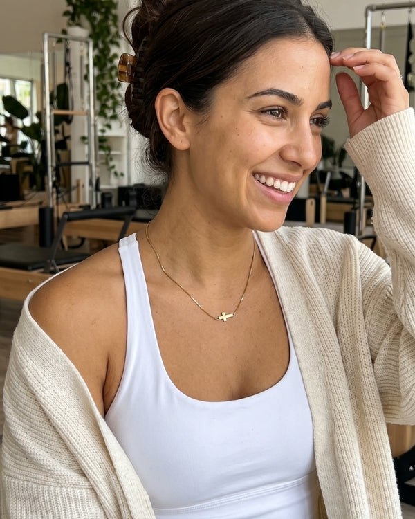 NAOMI S. wearing the Liora Cross Pendant Necklace