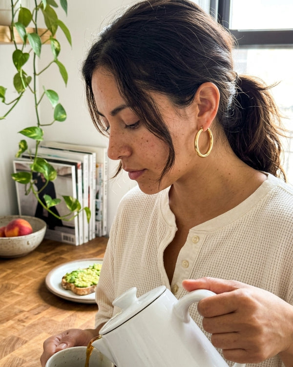 JESSA L. wearing the Astra Tube Hoop Earrings